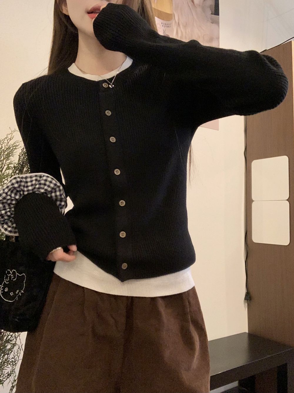Actual shot of three standard and fake two-piece cardigans and sweaters with contrasting design and knitted inner layers for women