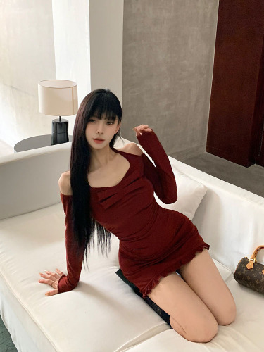 Real time shot of a wine red one shoulder long sleeved dress from a wealthy family, with a gold wrapped buttocks skirt and a plush jacket