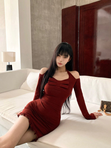 Real time shot of a wine red one shoulder long sleeved dress from a wealthy family, with a gold wrapped buttocks skirt and a plush jacket