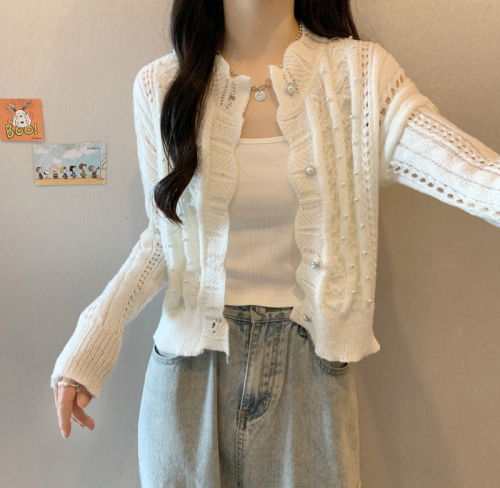 Actual shot of fairy beaded hollow knitted cardigan worn with an age-reducing short coat for women, a sweater top