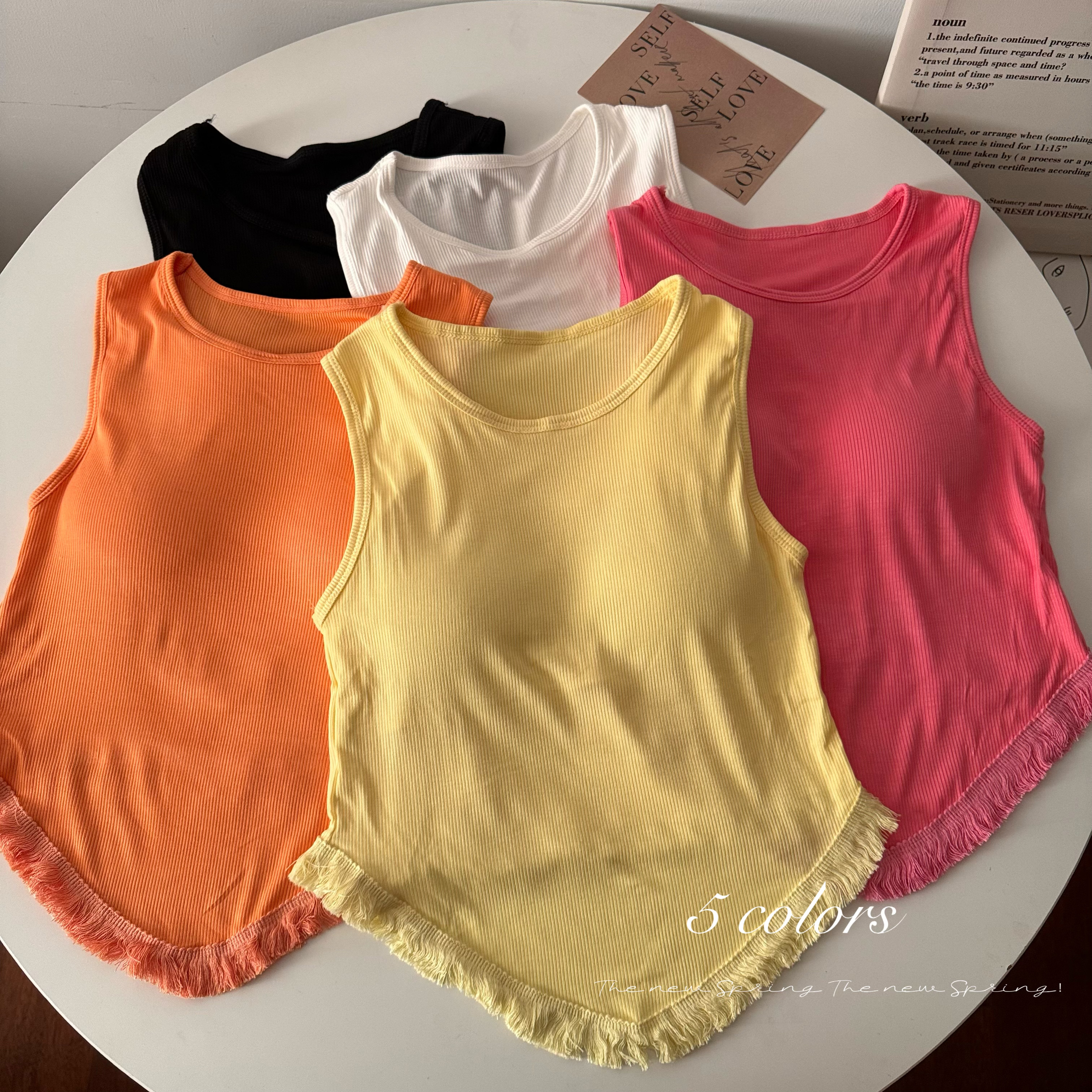 Real shot of new products in early spring, fashionable fur tassels, sexy solid color suspender, tank top, strapless women