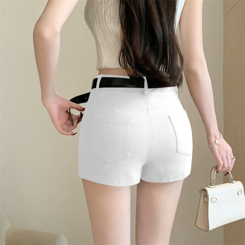Real shot of a hot girl wearing high-waisted butt-covering shorts with a love belt