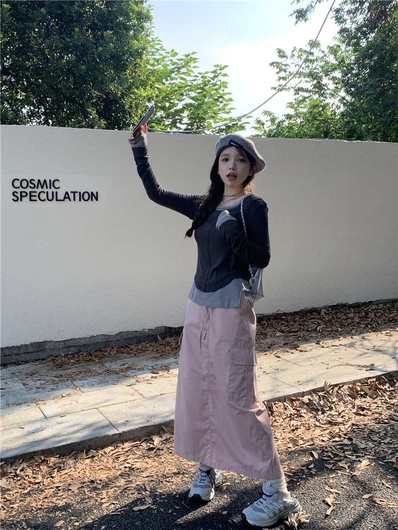 Actual shot of early spring design contrasting long-sleeved T-shirt + casual workwear style skirt