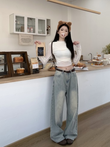 Real shot of fine-grained vintage washed straight wide-leg jeans