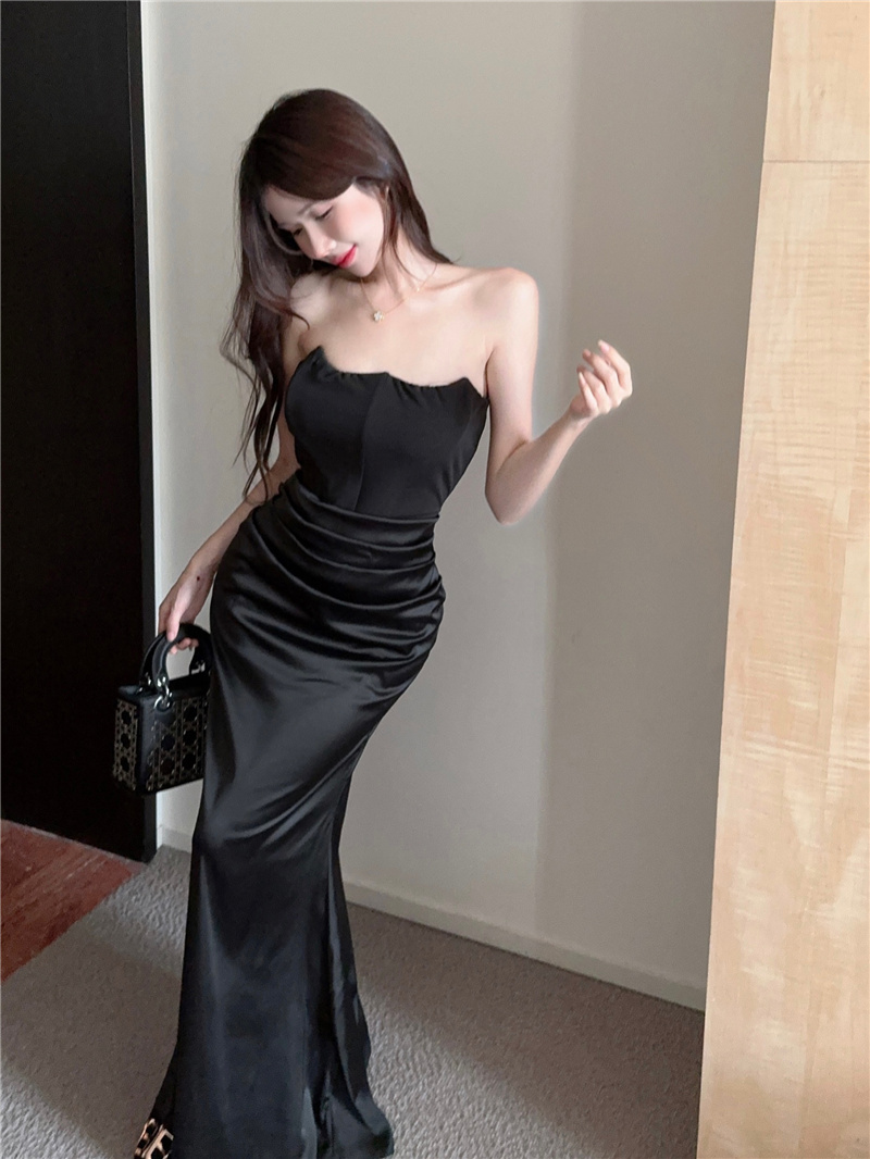 Real shot of strapless, backless, slim fitting dress and dress