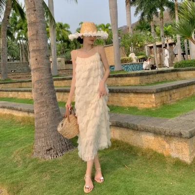 波西米亞白色吊帶洋裝女夏寬鬆流蘇法式海邊度假沙灘仙氣長裙子