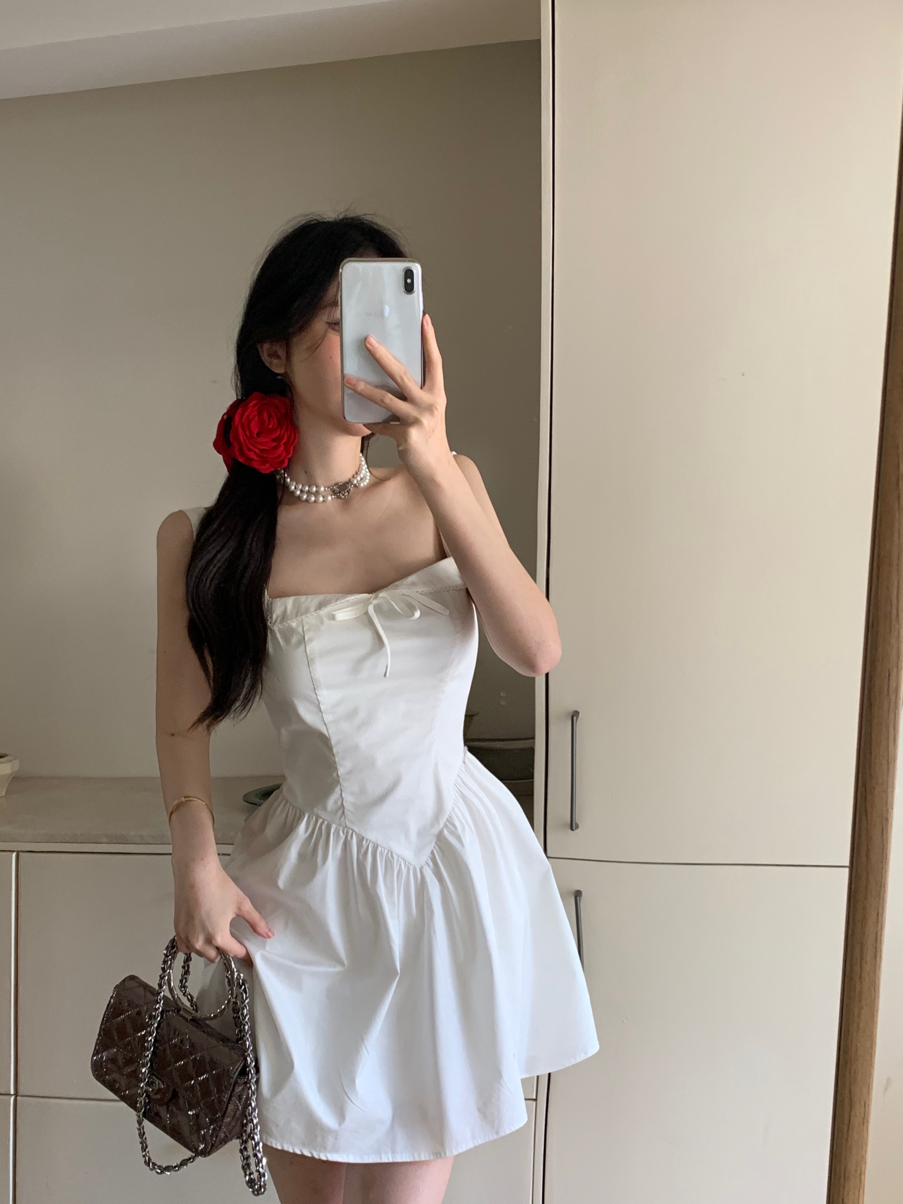 Actual shot of a unique and cool little white dress, a simple, slim and sexy suspender dress