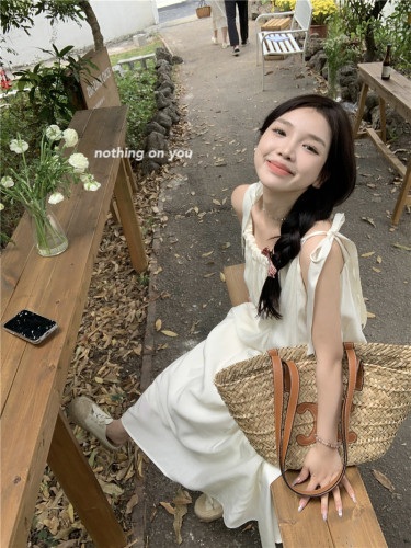 Real shot of gentle style suspender dress, vacation style, loose and slim dress