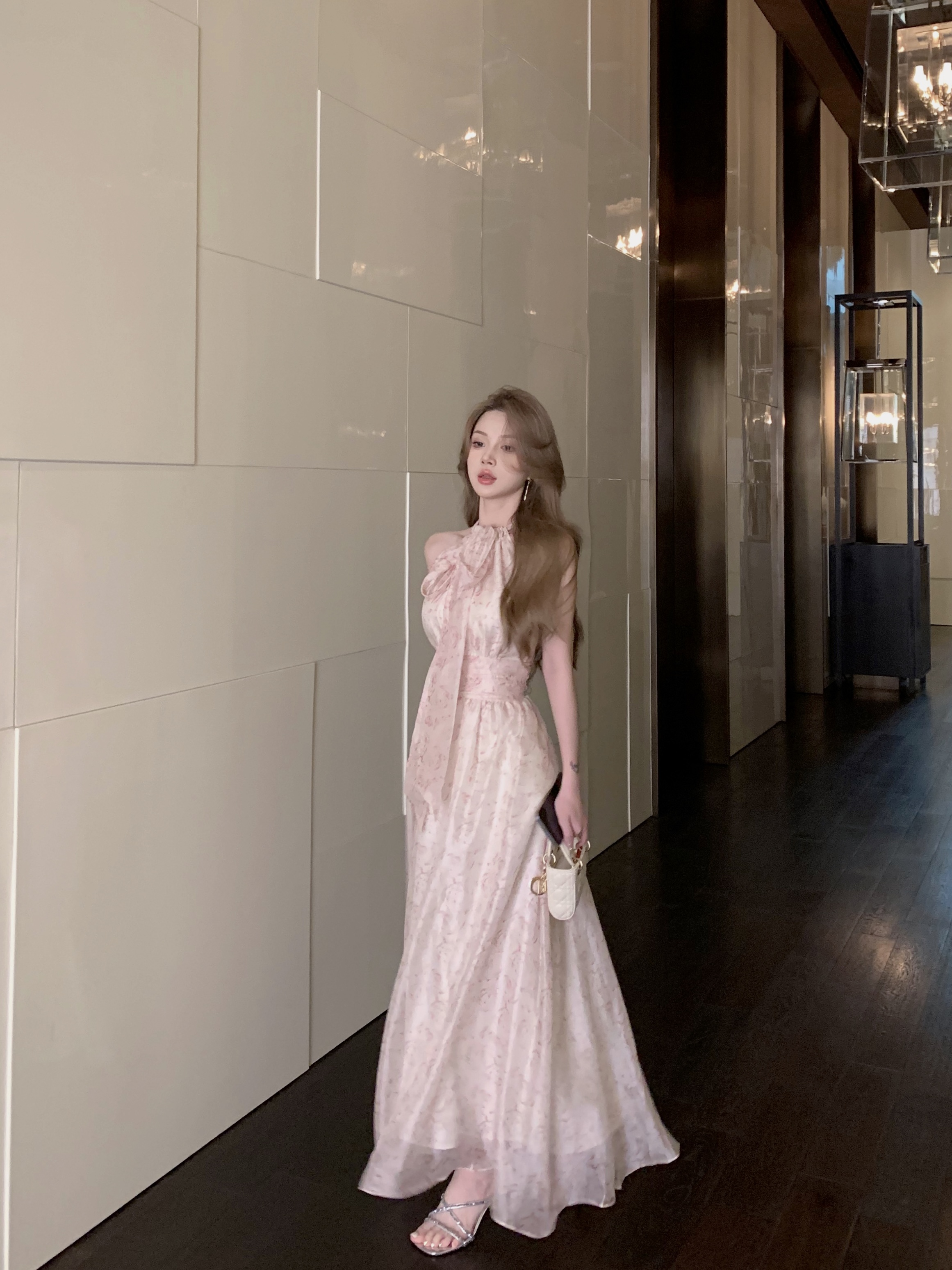 Actual shot of Moonfall Rose Pond tie bow halter neck waist and backless oversized drape skirt pearlescent dress
