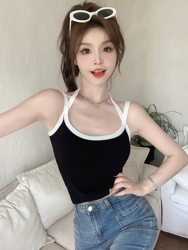 Real shot of a hot girl wearing pure lust off-shoulder short slim-fitting inner top with cross halter neck