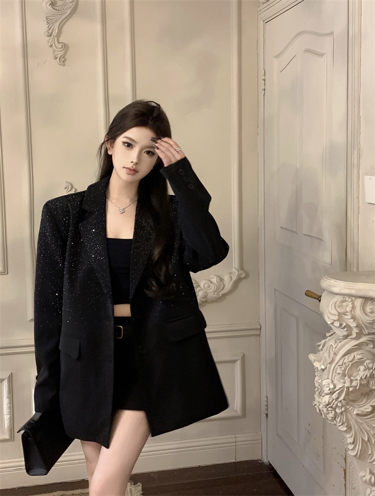 Actual shot of a high-end loose-fitting shiny diamond suit jacket