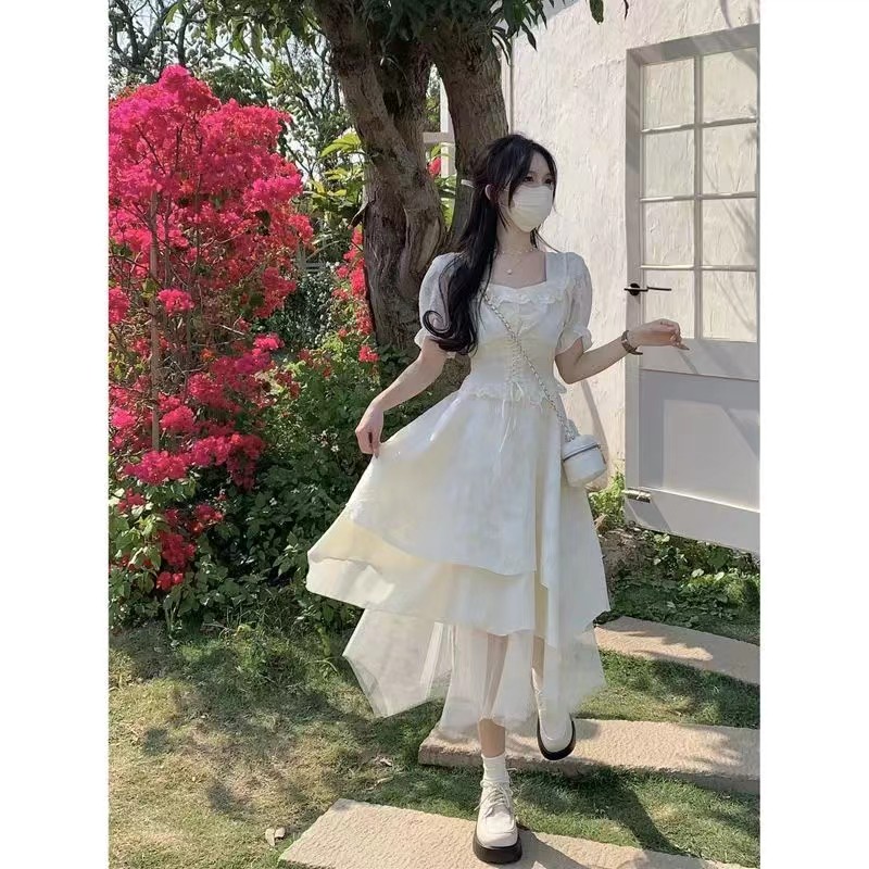 高級短袖淑女風仙女連衣裙長款法式名媛風收腰顯瘦不規則杏色裙子
