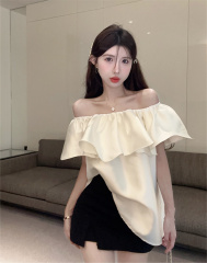 Real shot of elegant one-shoulder ruffled shirt and loose top