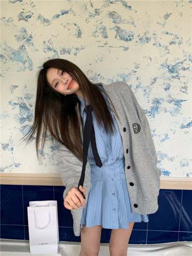 Real shot of college style layered suit, baseball jacket + long-sleeved striped shirt skirt two-piece set
