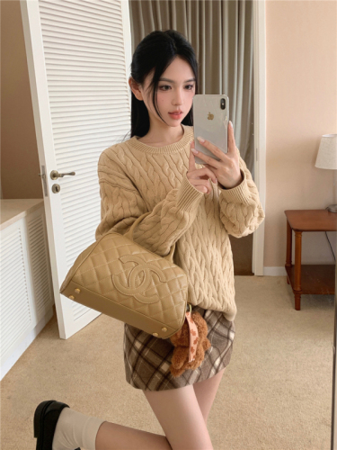 Real shot of large size autumn khaki twist autumn and winter loose lazy knitted jacket + plaid skirt