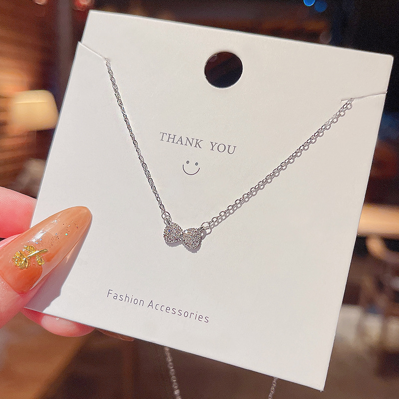 Real shot of simple niche design bow pendant titanium steel necklace women's ins fashion clavicle chain