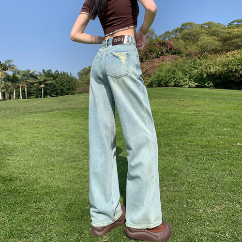 Actual shot of new spring light blue ripped jeans for women, high-waisted, slim, straight, small, floor-length wide-leg pants