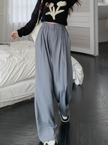Actual shot of gray high-waisted wide-leg suit pants and slim casual pants
