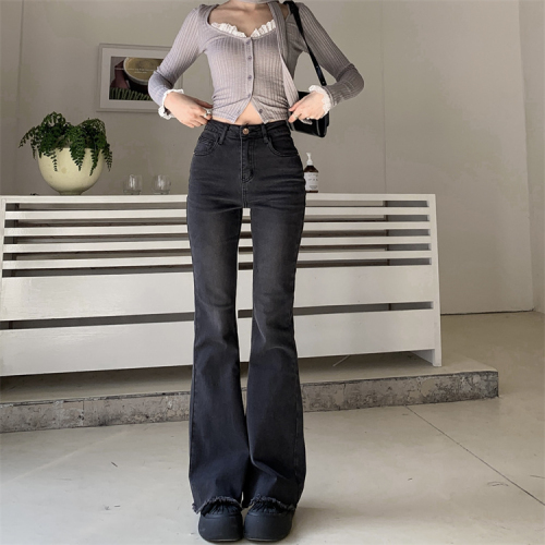 Actual shot of smoked black stretch pants and jeans, high-waisted bootcut pants, floor-length pants for women