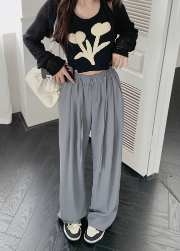 Actual shot of gray high-waisted wide-leg suit pants and slim casual pants