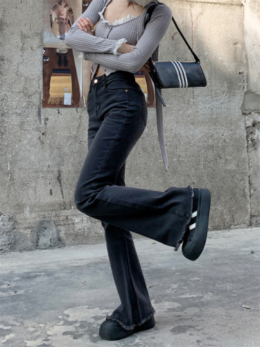 Actual shot of smoked black stretch pants and jeans, high-waisted bootcut pants, floor-length pants for women