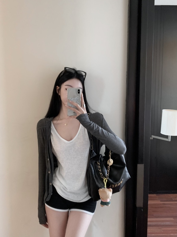 Actual shot of gray knitted hooded cardigan, hemp vest and sports shorts suit