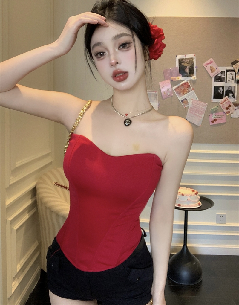 Actual shot of a pure lust hottie wearing a fishbone corset with a bottom bra pad and a tube top for a niche female camisole