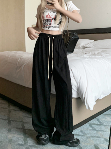 Actual shot of lazy, simple, drapey drawstring casual pants, high-waisted slimming floor-length pants