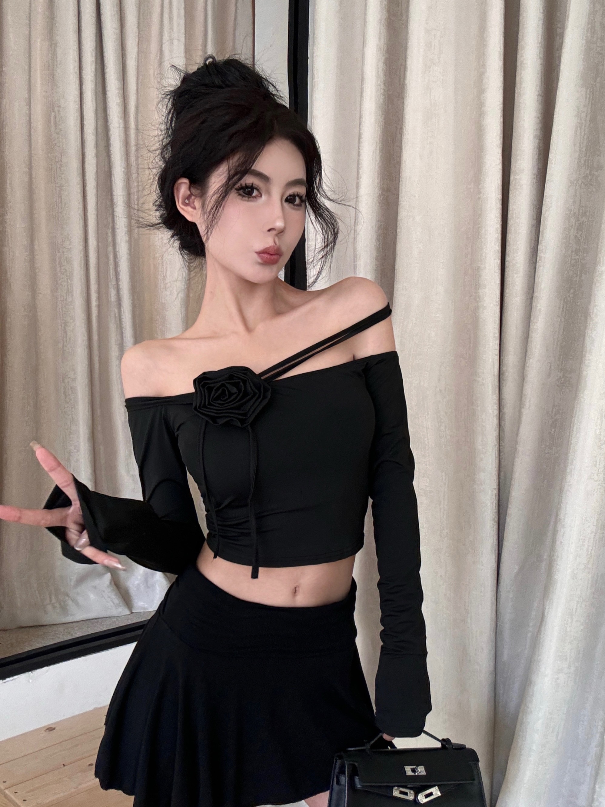 Real shot of off-shoulder top with one-shoulder floral strap design, high waist and slimming skirt.