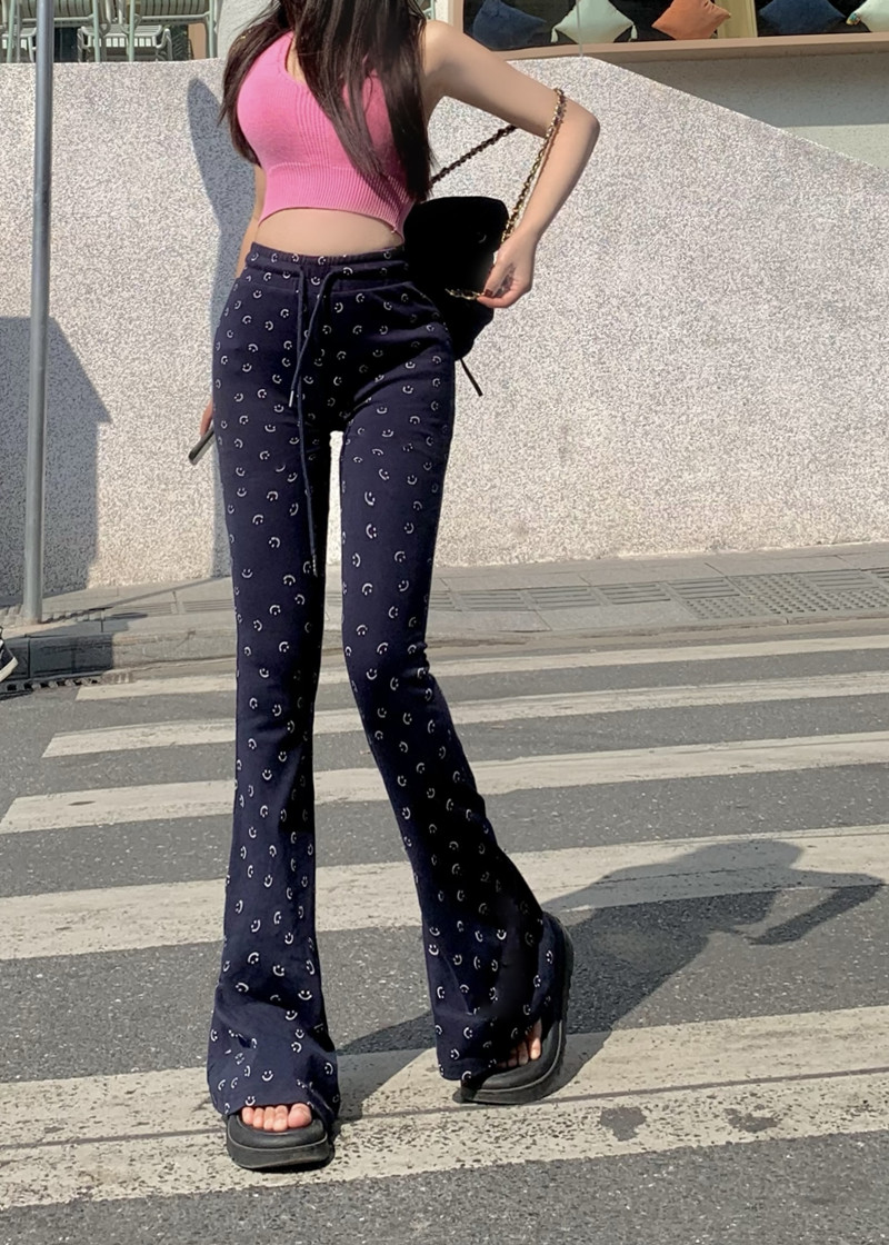 Actual shot of high-waisted slimming smiley face printed bell-bottoms and versatile pants