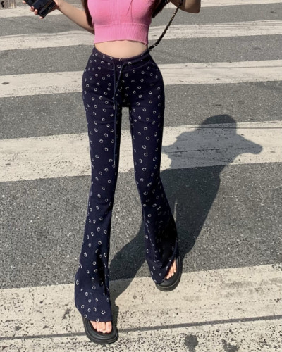 Real shot of extremely comfortable blue smiley face pants with slightly flared floor-length trousers for women with high waist and long legs and elastic waist