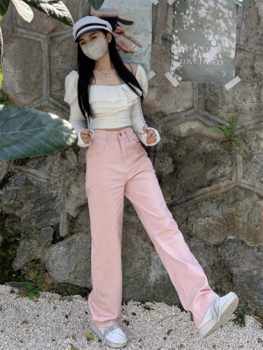 Actual shot of girly pink straight wide-leg pants, high-waisted, fresh and slim jeans