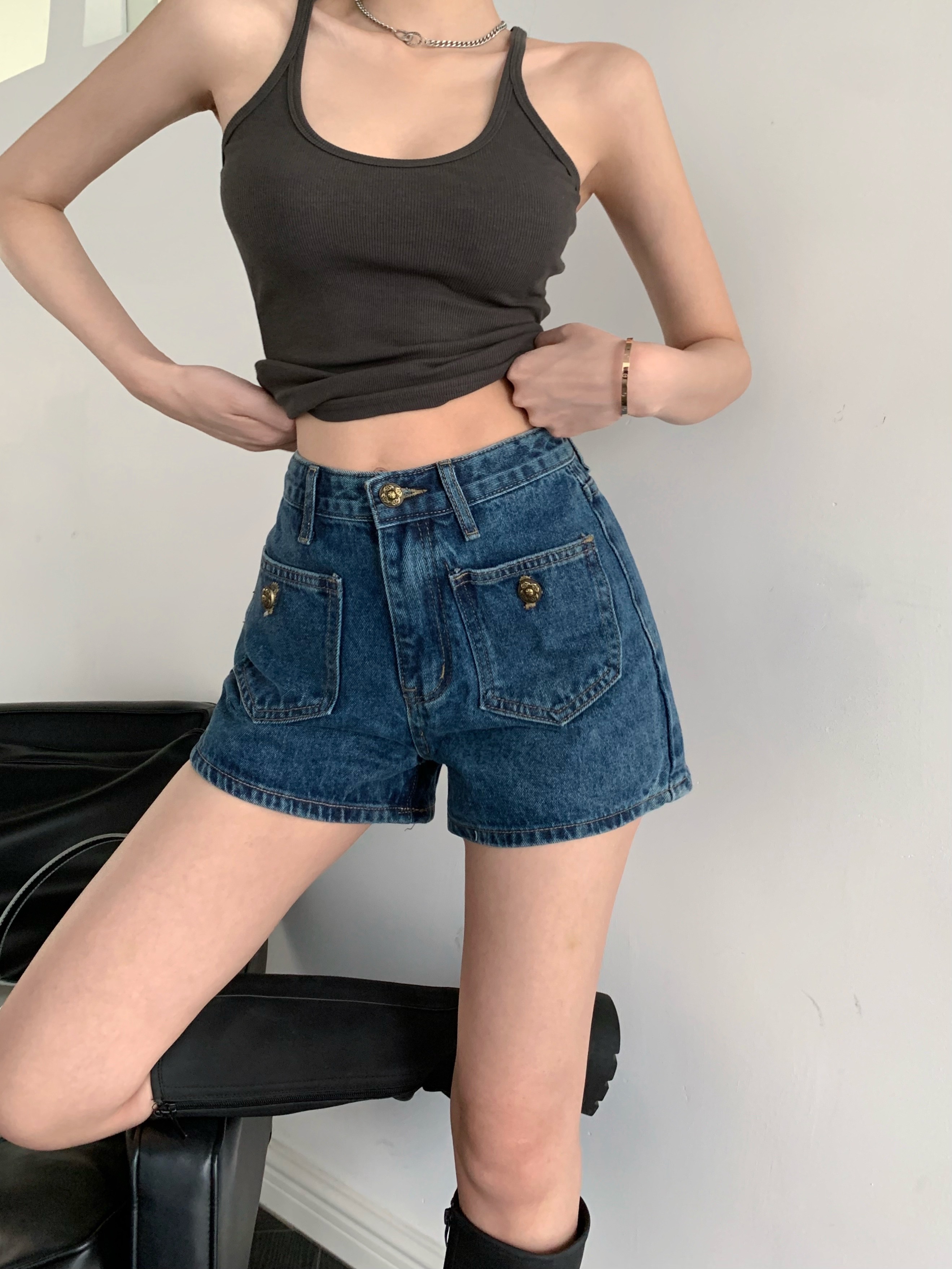 Actual shot of high-waisted, wide-legged, slim, casual and versatile denim shorts