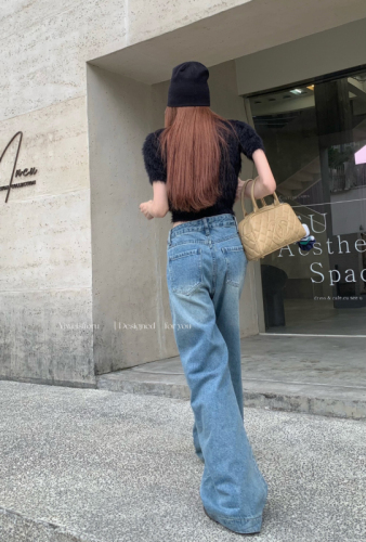 Actual shot of spring loose wide-leg washed blue straight floor-length denim trousers