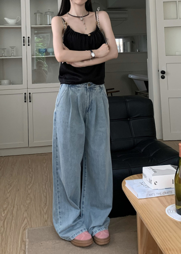 Actual shot of high-waisted slimming loose wide-leg jeans for women with drapey and versatile floor-length mopping pants