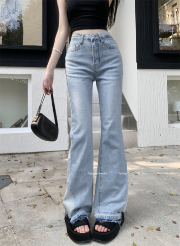 Actual shot of new high-waisted elastic slightly flared slim-fitting long raw edge jeans for women