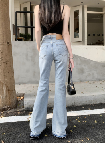 Actual shot of new high-waisted elastic slightly flared slim-fitting long raw edge jeans for women