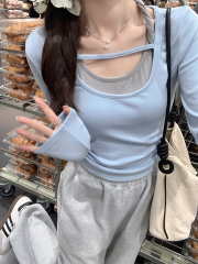 Real shot of a pure sexy hottie wearing a fake short top with two long-sleeved T-shirts