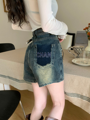 Real shot of high-waisted retro versatile rivet embroidered denim short skirt.