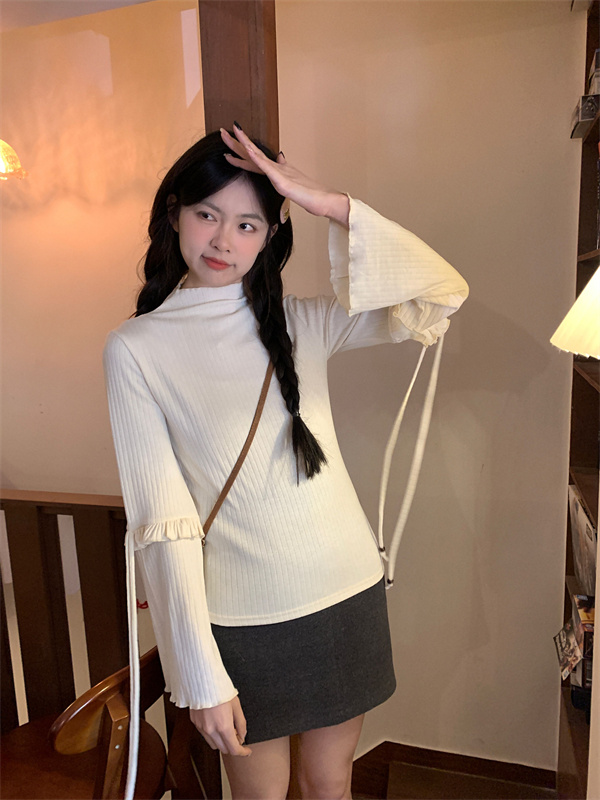 Actual shot of spring’s new sweet and versatile turtleneck butterfly strap slimming top
