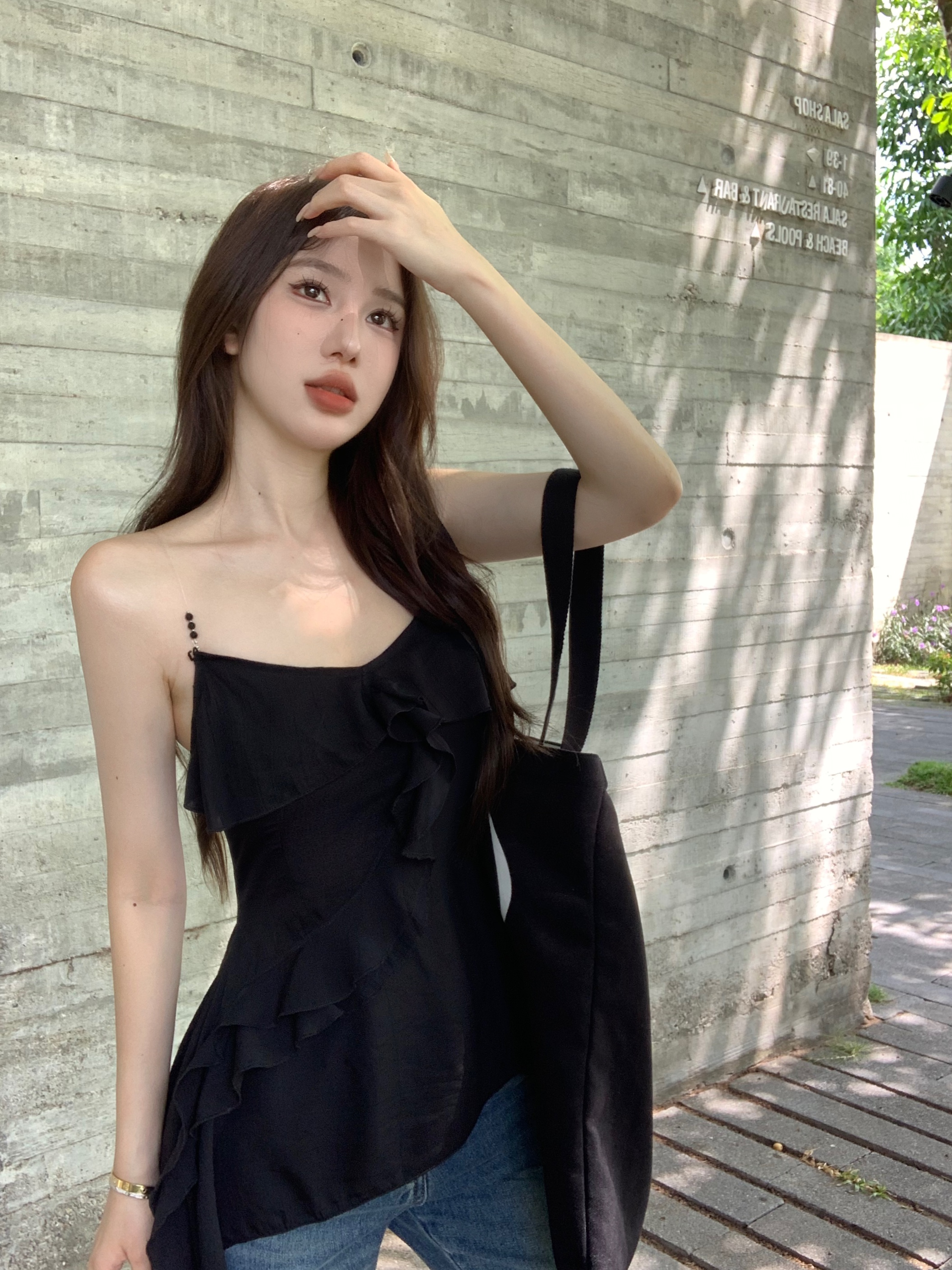 Actual shot of beaded transparent shoulder straps, black V-neck ruffled hem vest with design straps