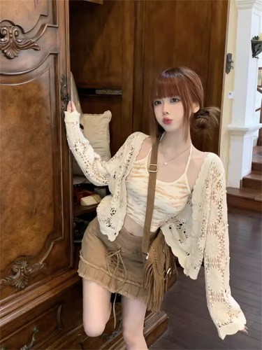 Spring and summer hot girl suspender outer blouse niche design hollow knitted sweater cardigan coat women's sun protection top