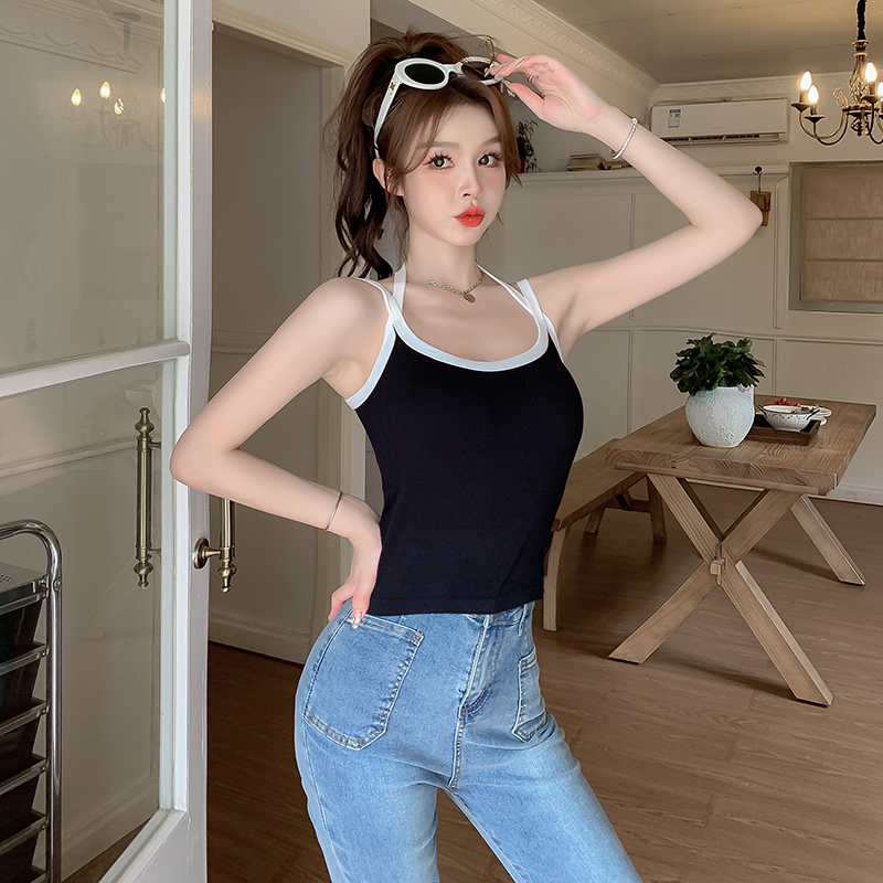 Real shot of a hot girl wearing pure lust off-shoulder short slim-fitting inner top with cross halter neck