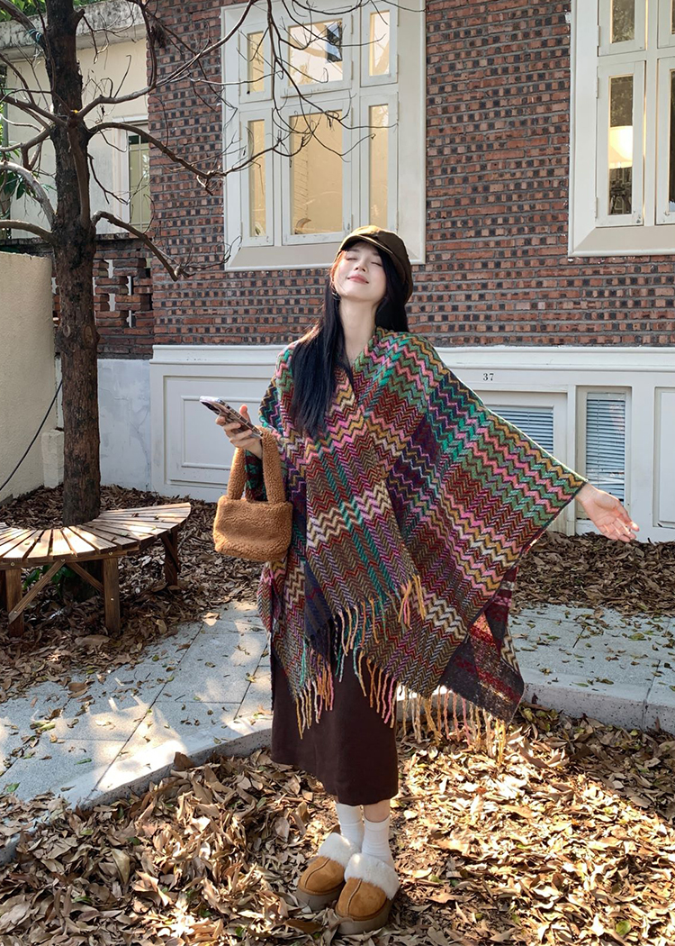 Actual shot of early spring warm ethnic style shawl blanket worn with a knitted cardigan cloak