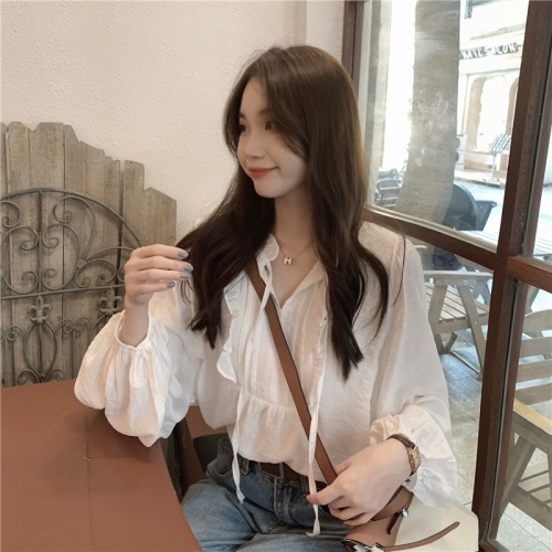 Actual shot of Korean-style temperament V-neck white long-sleeved top with straps and spliced ​​earring design loose shirt