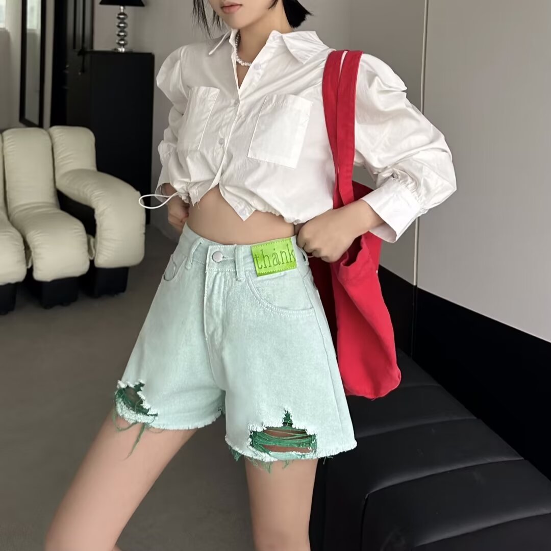綠色牛仔短褲女夏薄2024新款高腰a字粉色毛邊流蘇破洞辣妹熱褲