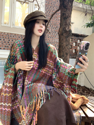 Actual shot of early spring warm ethnic style shawl blanket worn with a knitted cardigan cloak