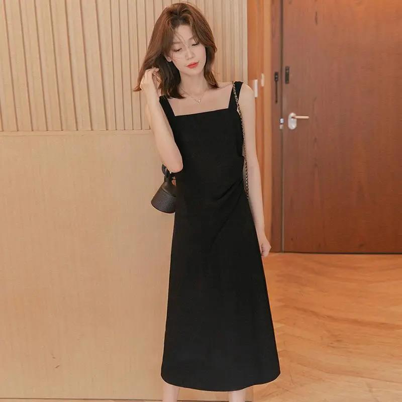 小穀粒吊帶連衣裙女2024春夏款高級感小黑裙遮肉顯瘦小個子長裙子
