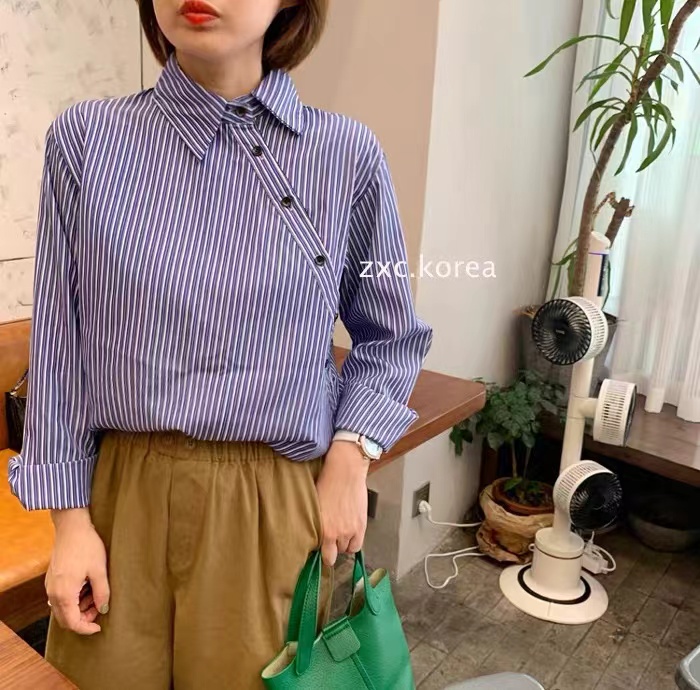 春秋韓版藍色條紋寬鬆襯衫女設計感小眾斜排扣疊穿襯衣
