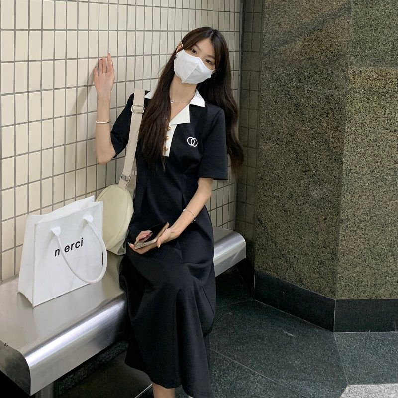 \夏季新款純欲學院風收腰顯瘦POLO領短袖設計感黑色長裙A字裙子女